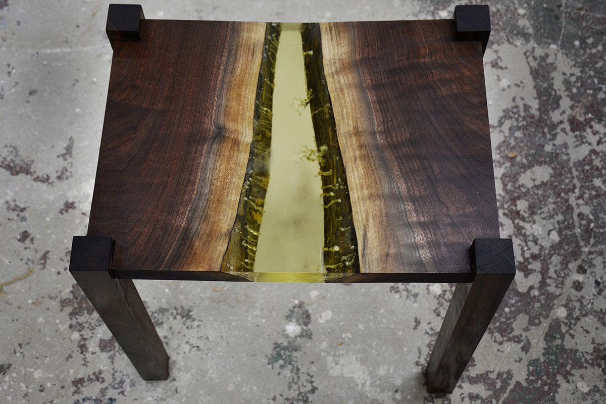 A short coffee table made of dark wood.